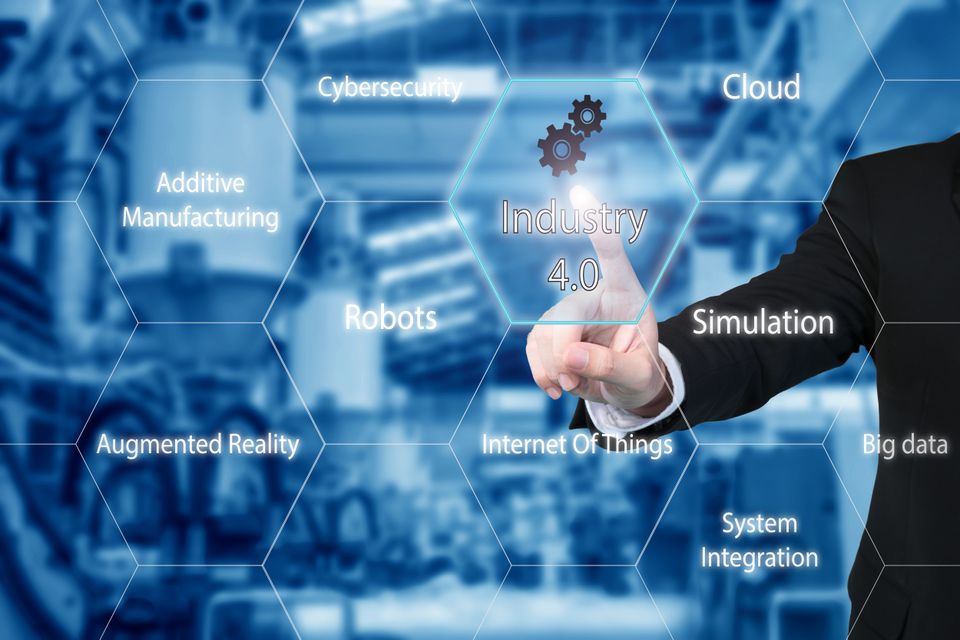 Business man touching industry 4.0 icon in virtual interface